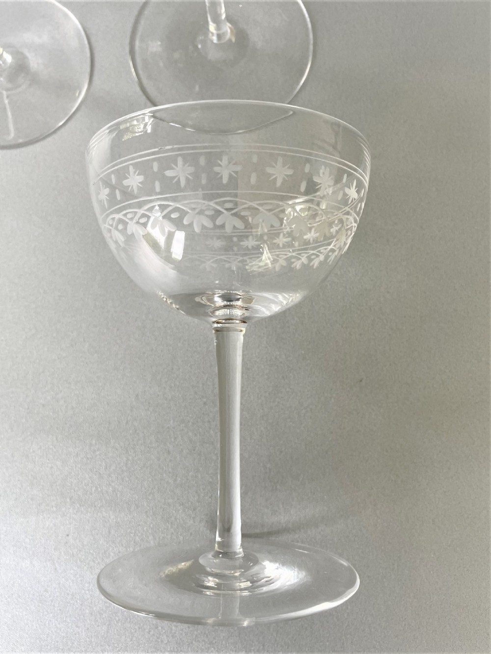 A lovely set of 6 Victorian etched glass champagne coupes View V