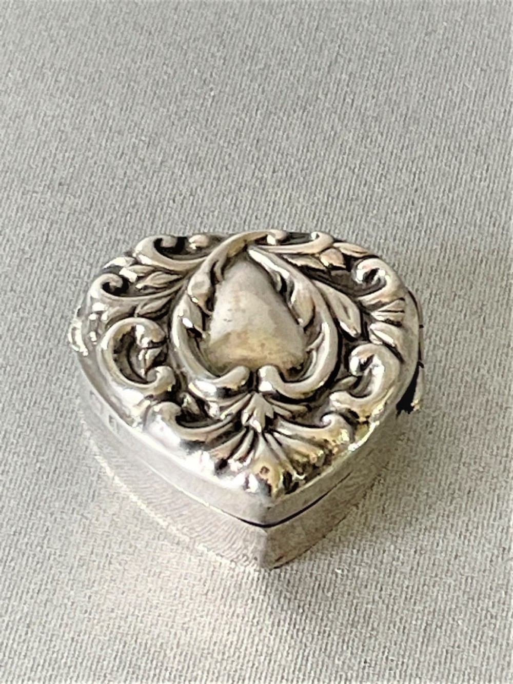 A small late Victorian heart shaped silver pill box