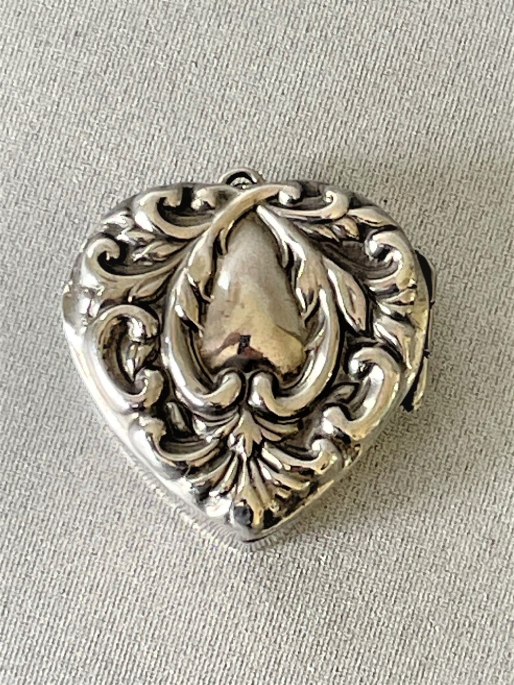 A small late Victorian heart shaped silver pill box View II