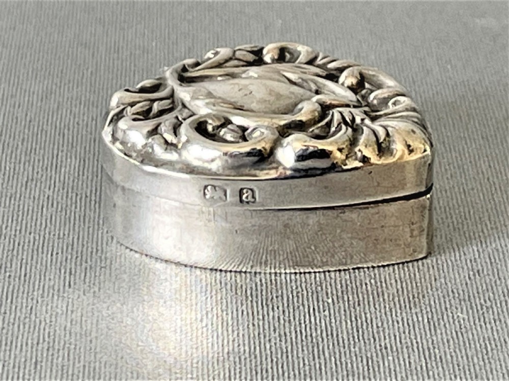A small late Victorian heart shaped silver pill box View III