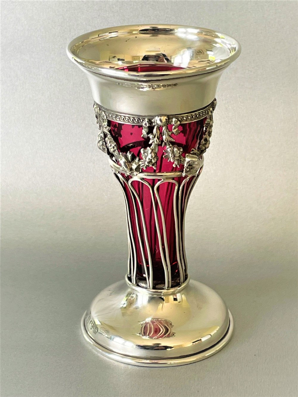 A pretty Edwardian silver & cranberry glass bud vase