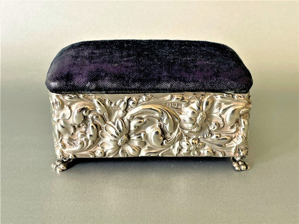 A lovely silver cased trinket box with pin cushion lid View II
