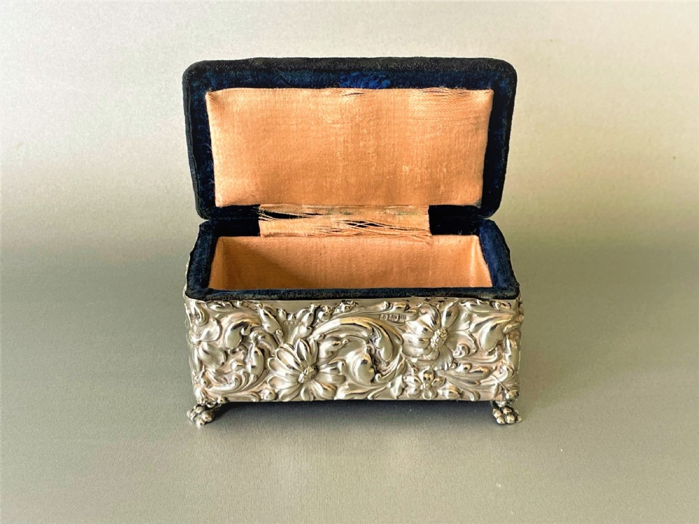 A lovely silver cased trinket box with pin cushion lid View III