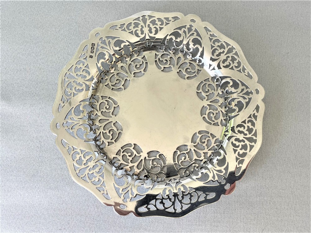A lovely George V pierced silver wine bottle/decanter coaster View IV