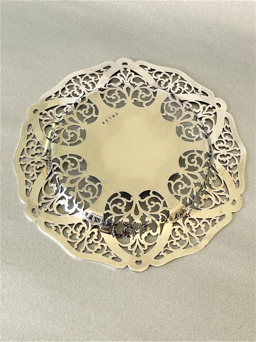 A lovely George V pierced silver wine bottle/decanter coaster View V