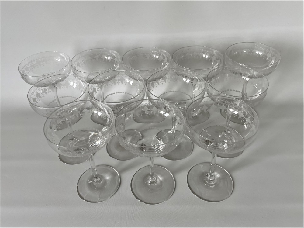 An extremely rare set of 12 Victorian etched champagne glasses View II