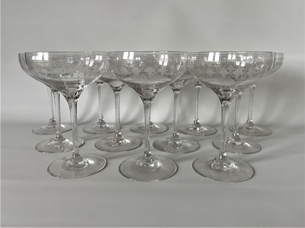 An extremely rare set of 12 Victorian etched champagne glasses View III