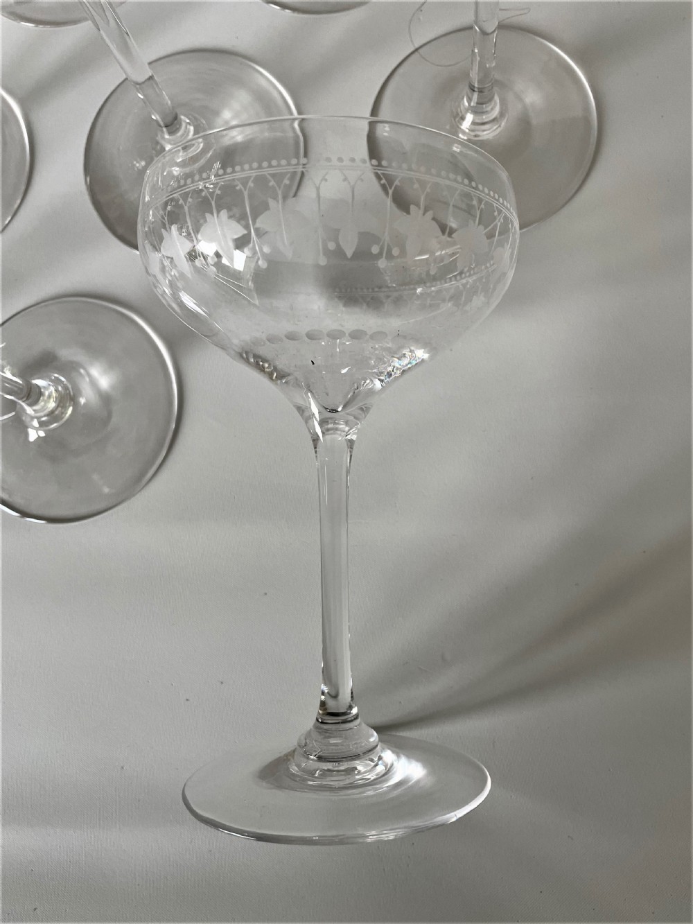 An extremely rare set of 12 Victorian etched champagne glasses View IV
