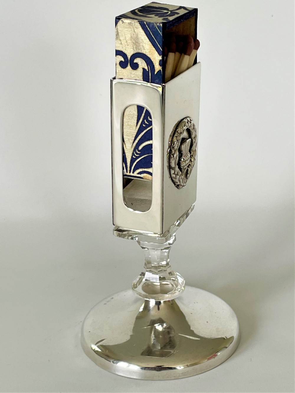 An unusual hallmarked silver & glass matchbox stand View II
