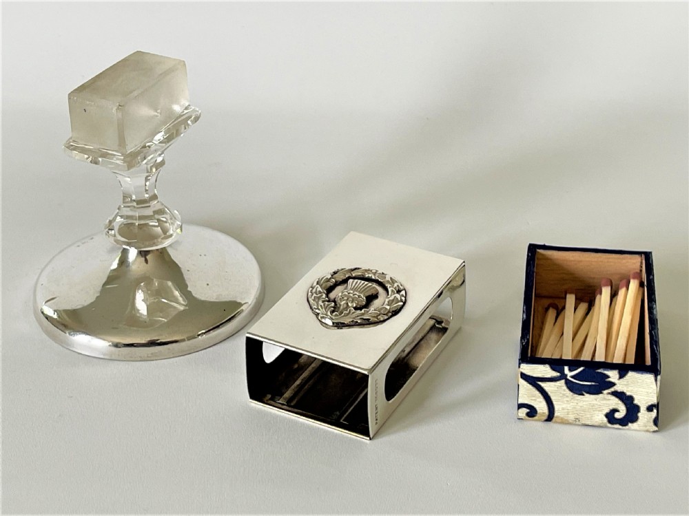 An unusual hallmarked silver & glass matchbox stand View III