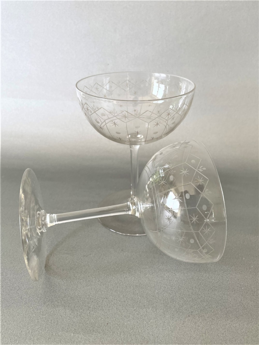 An elegant pair of Victorian etched glass champagne coupes View III