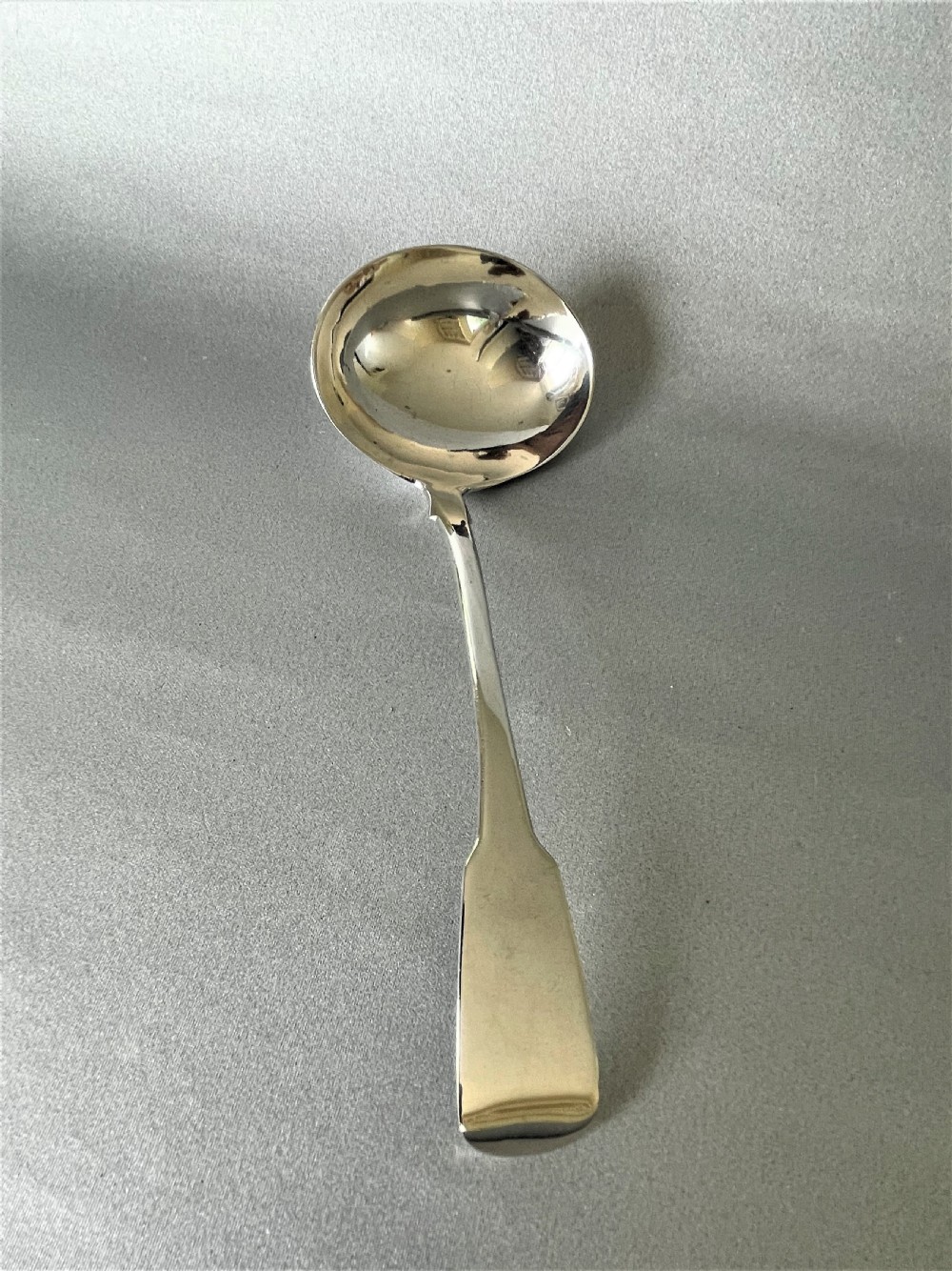 An unusual Irish silver rat-tail silver gravy ladle
