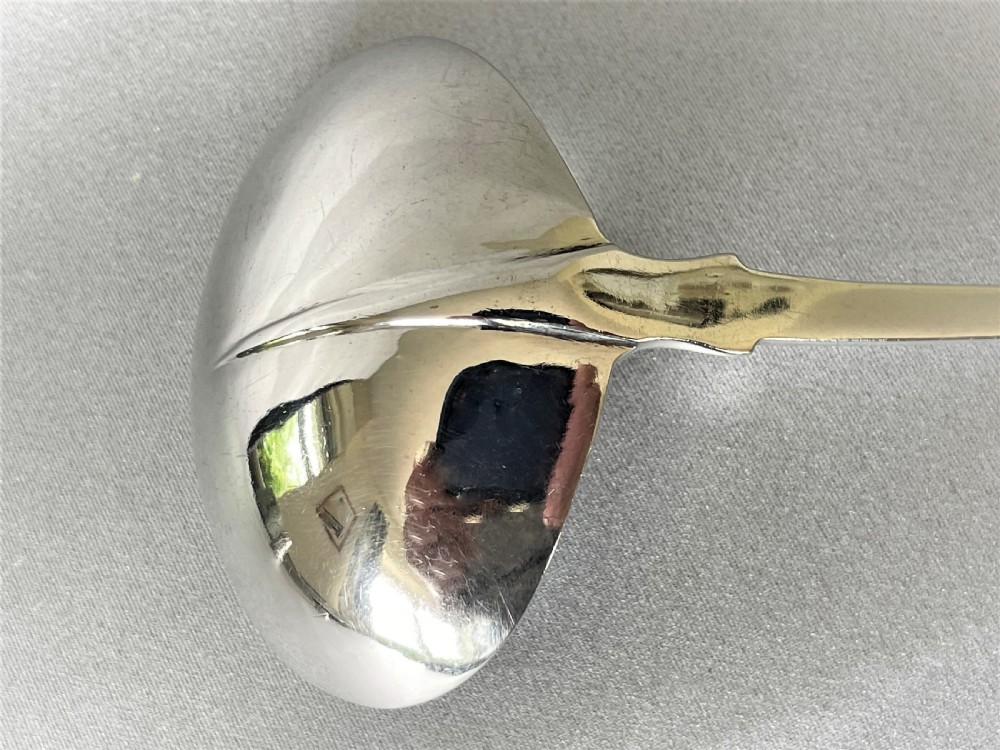 An unusual Irish silver rat-tail silver gravy ladle View III