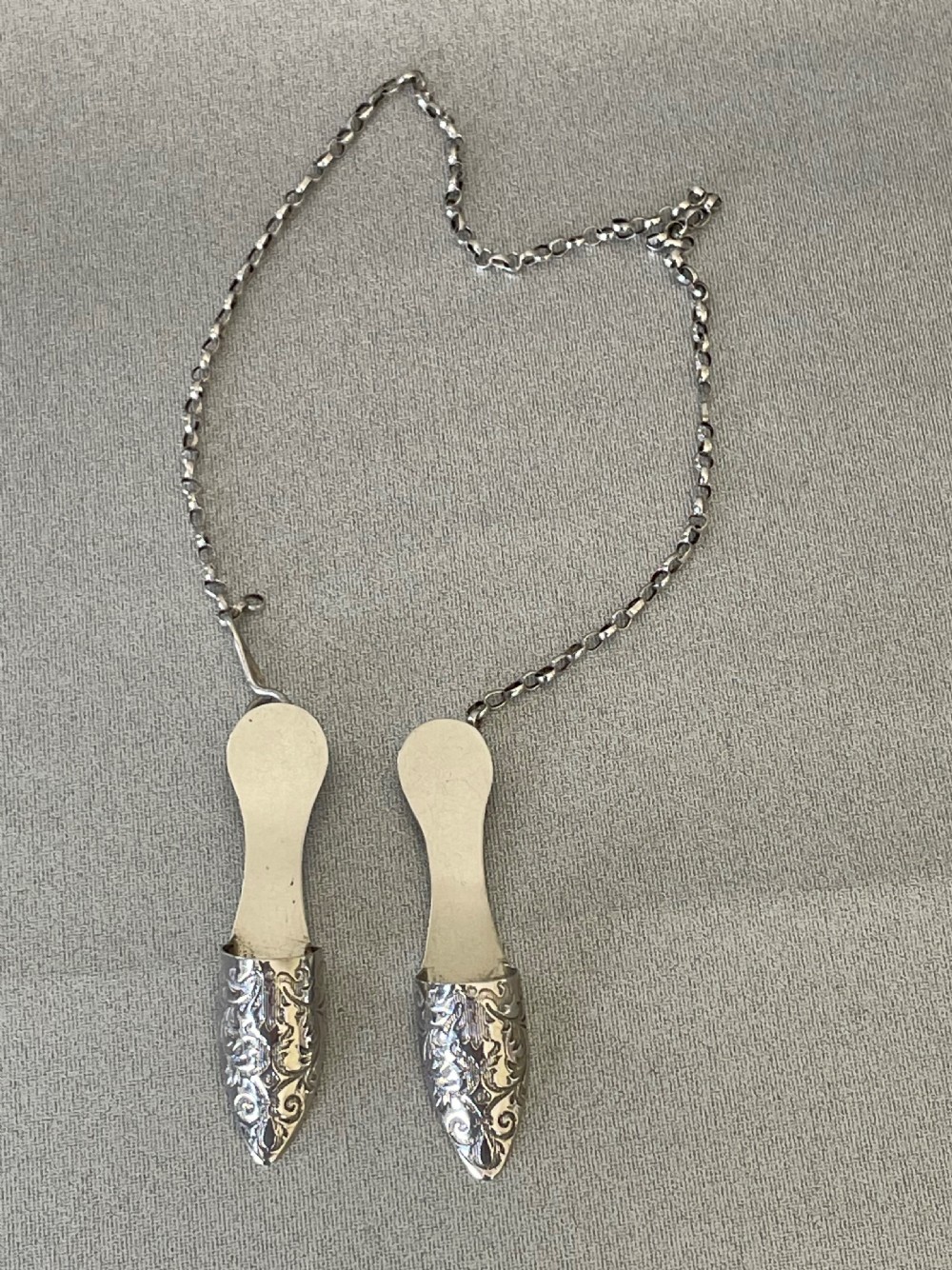 A rare pair of Georgian silver novelty needle guards View V