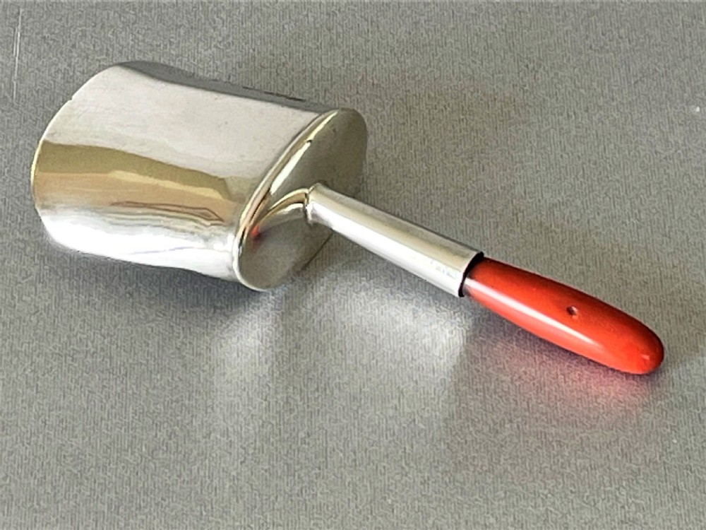 A Georgian silver & coral caddy shovel. Female silversmith. View VI