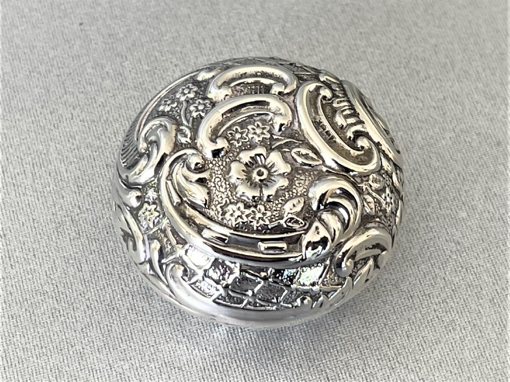 An unusual Edwardian silver repousse pill box View II