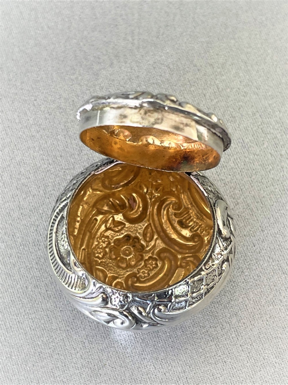 An unusual Edwardian silver repousse pill box View III