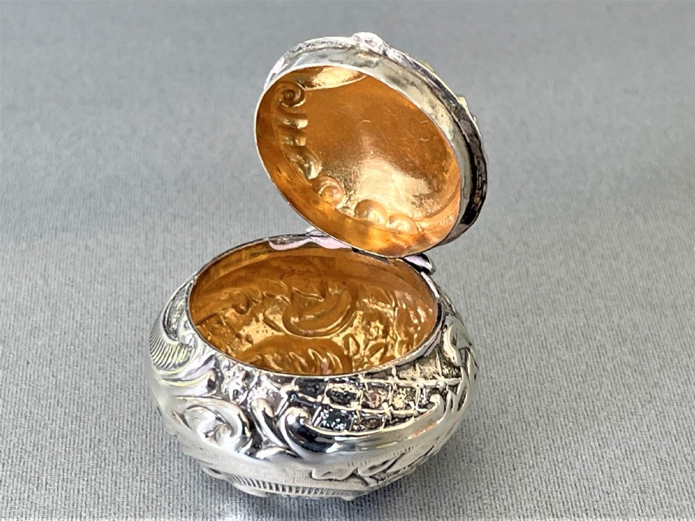 An unusual Edwardian silver repousse pill box View IV