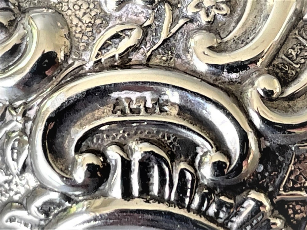 An unusual Edwardian silver repousse pill box View V