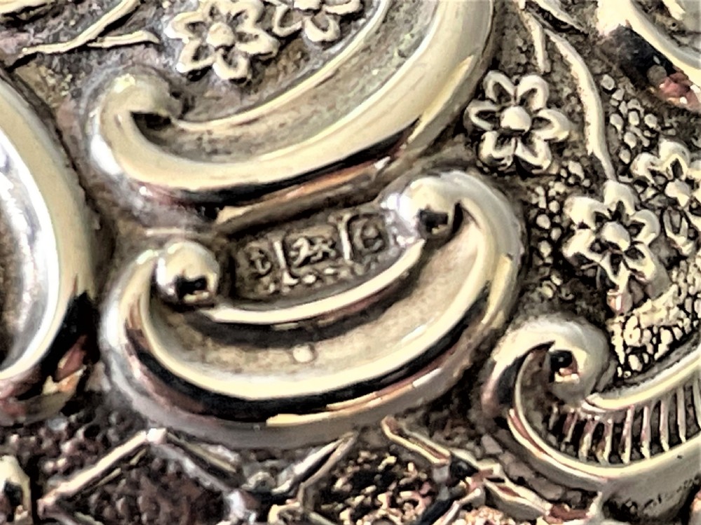 An unusual Edwardian silver repousse pill box View VI