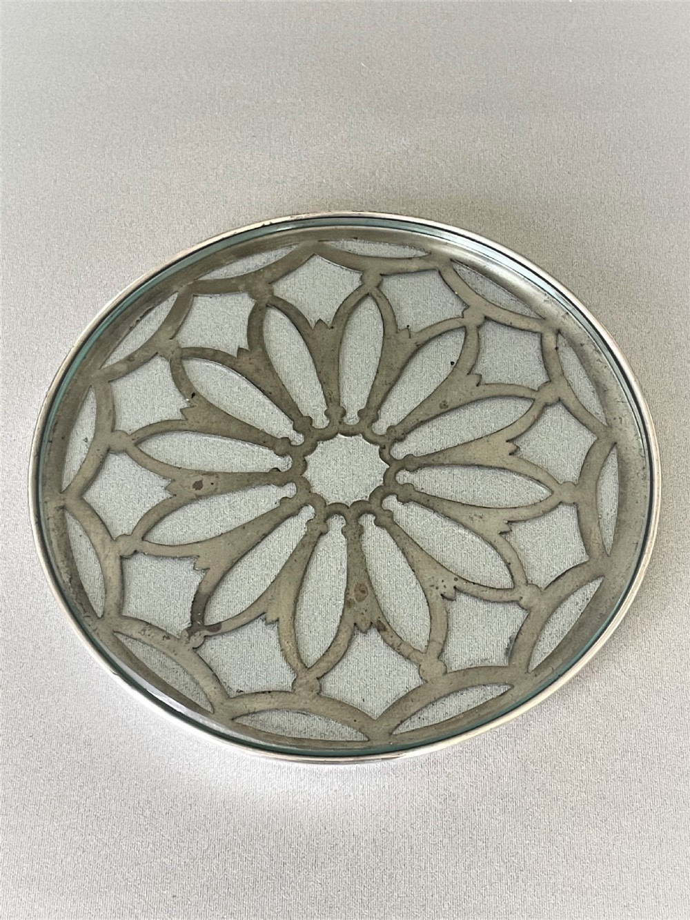 A delightful small silver teapotstand/coaster View II