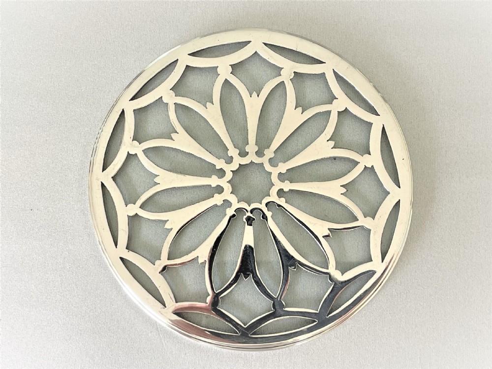 A delightful small silver teapotstand/coaster View IV