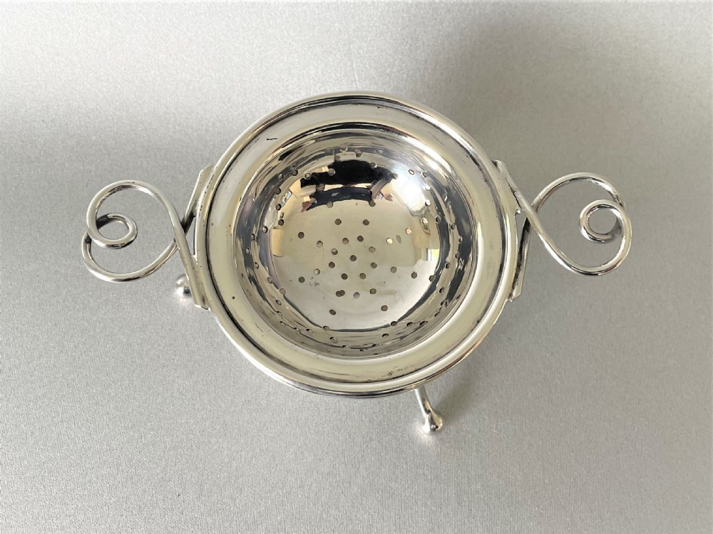 A Chester silver tea strainer & matching drip cup View II
