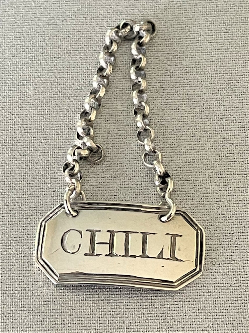 A rare Georgian Chili silver bottle ticket