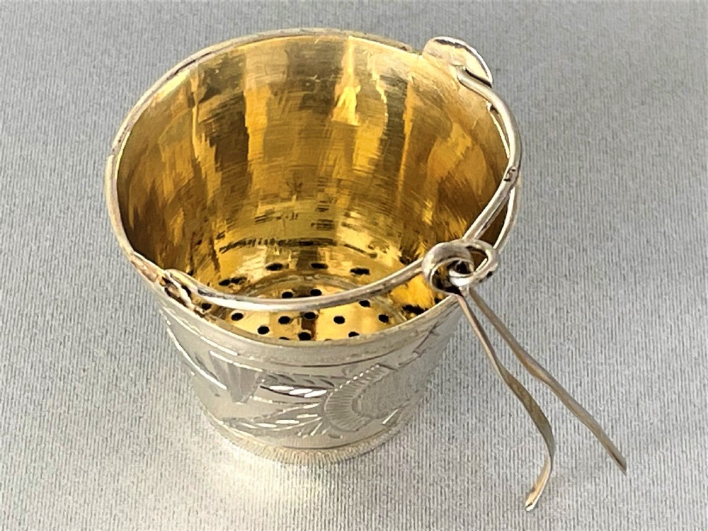 A superb pre-revolution Russian silver gilt novelty tea strainer View II