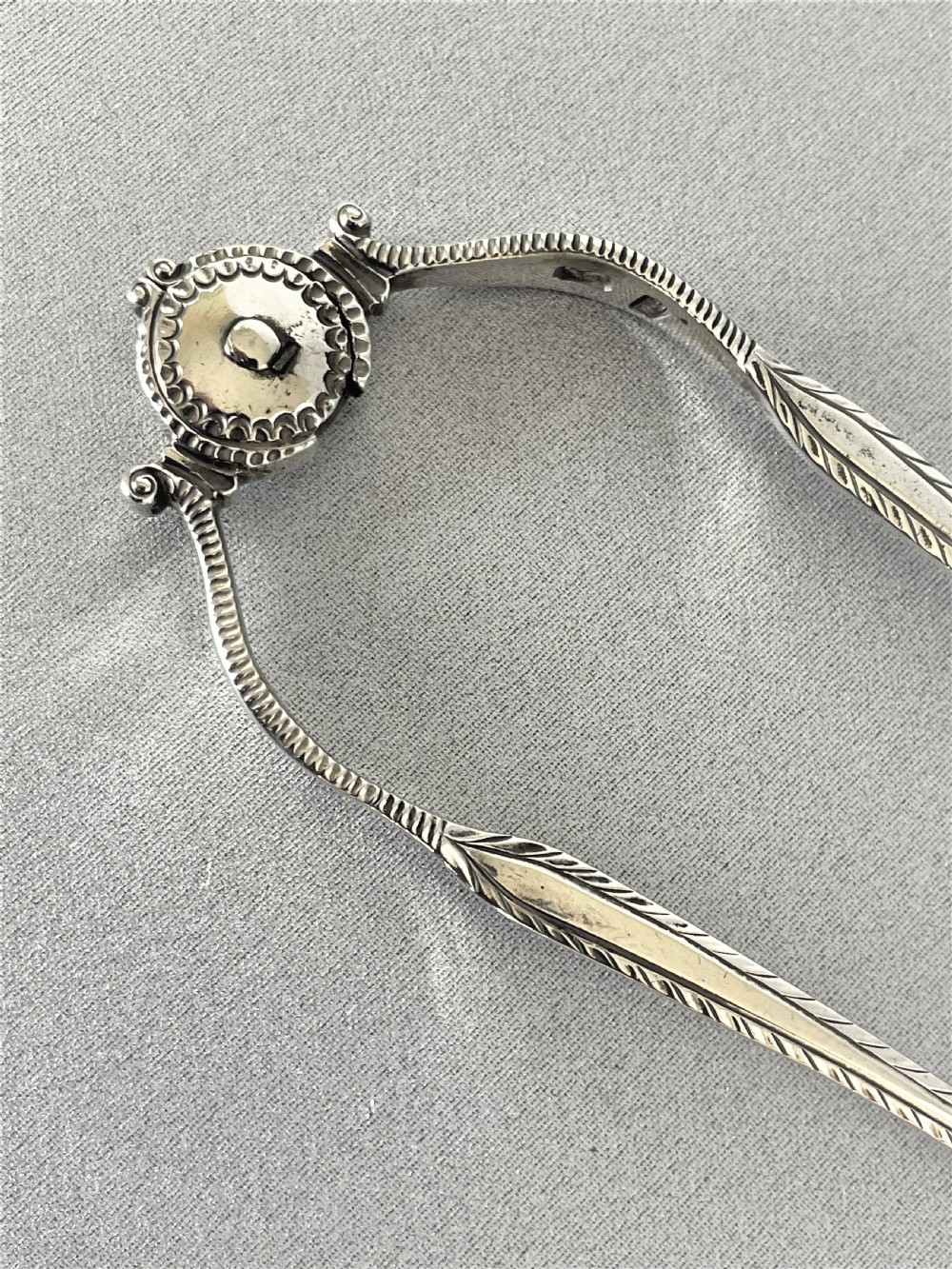 An extremely rare pair of 18th Century sprung silver tongs View II