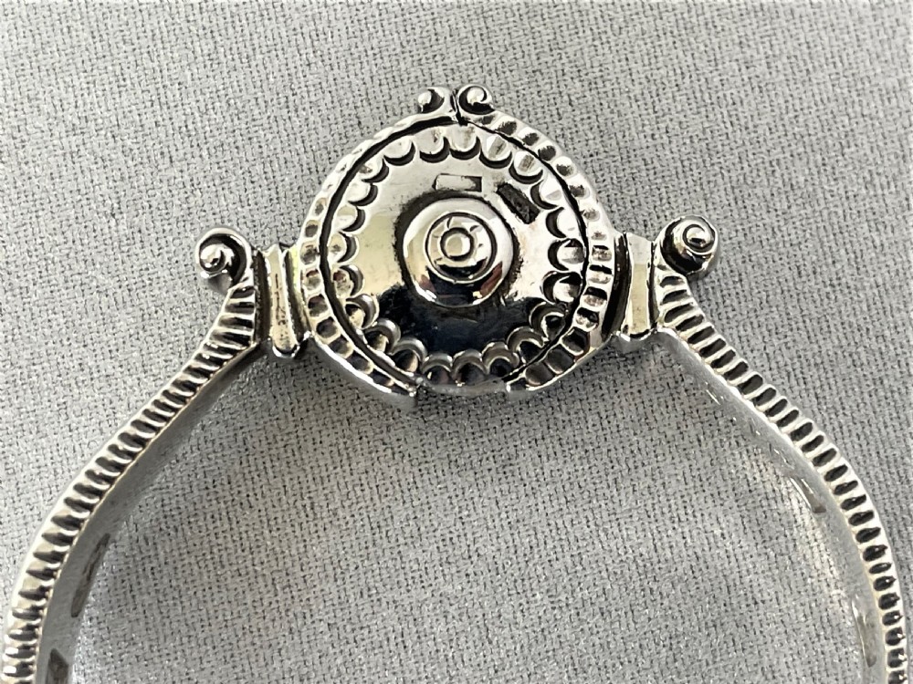 An extremely rare pair of 18th Century sprung silver tongs View VI