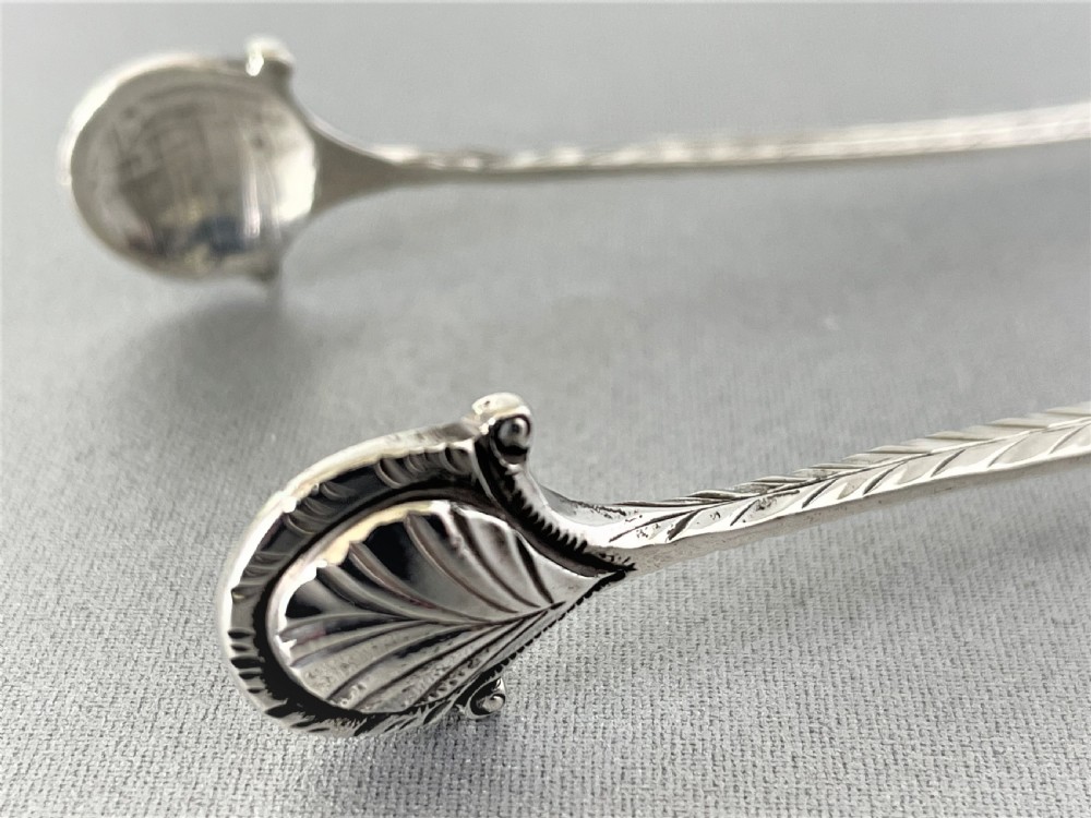 An extremely rare pair of 18th Century sprung silver tongs View VII
