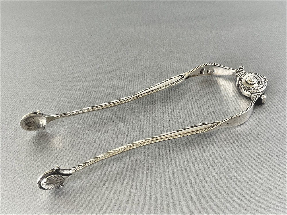An extremely rare pair of 18th Century sprung silver tongs View VIII