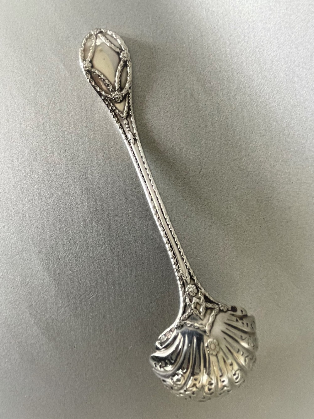 A fully cast Victorian silver sugar sifting ladle View IV