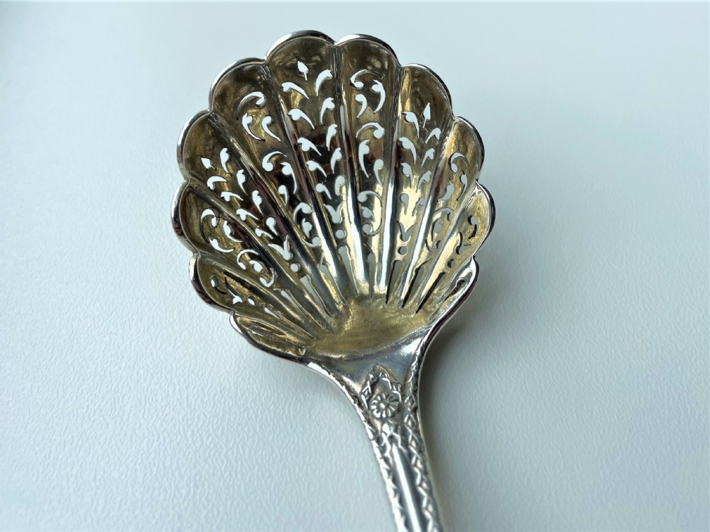 A fully cast Victorian silver sugar sifting ladle View VIII