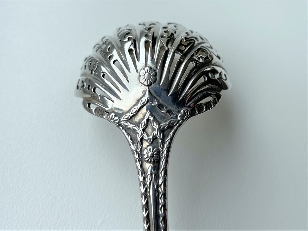 A fully cast Victorian silver sugar sifting ladle View IX