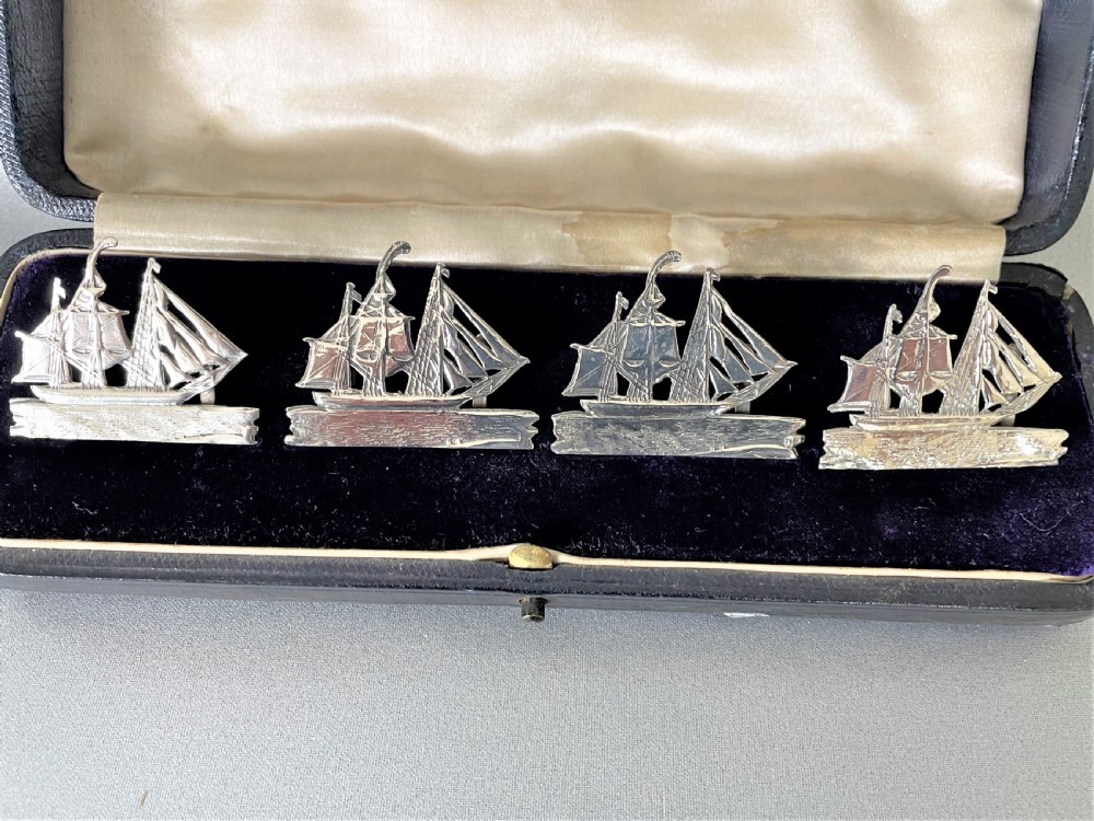 A fabulous set of 4 boxed Victorian silver ship menu card holders View II