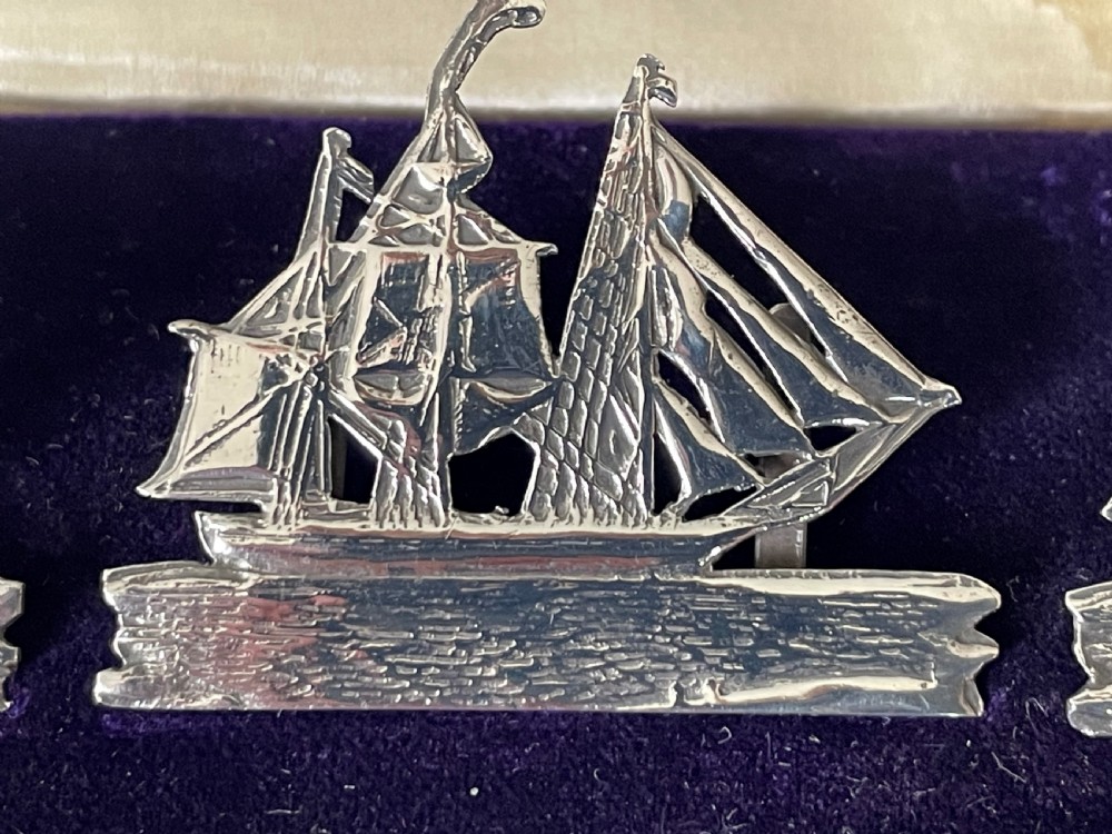 A fabulous set of 4 boxed Victorian silver ship menu card holders View V