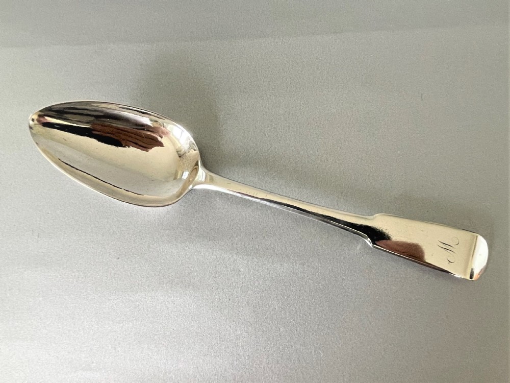 A handsome Georgian Scottish silver table/serving spoon