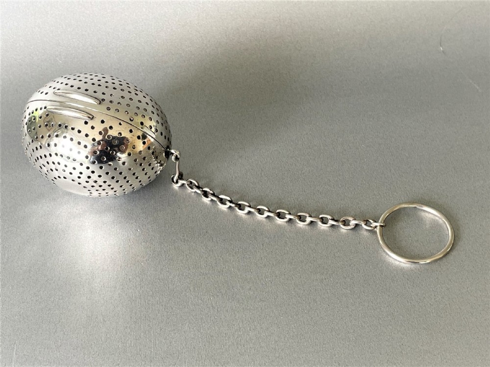 A rare Victorian silver 'egg' tea infuser