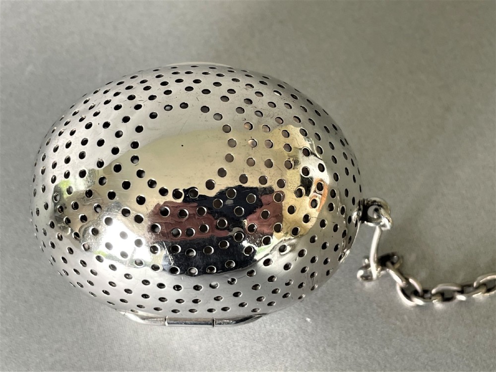A rare Victorian silver 'egg' tea infuser View II