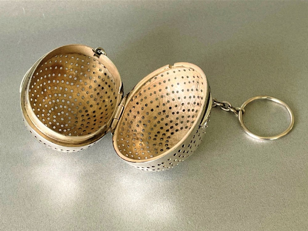 A rare Victorian silver 'egg' tea infuser View III