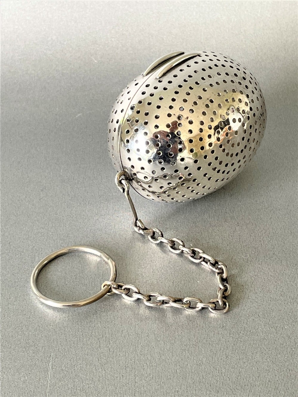 A rare Victorian silver 'egg' tea infuser View V