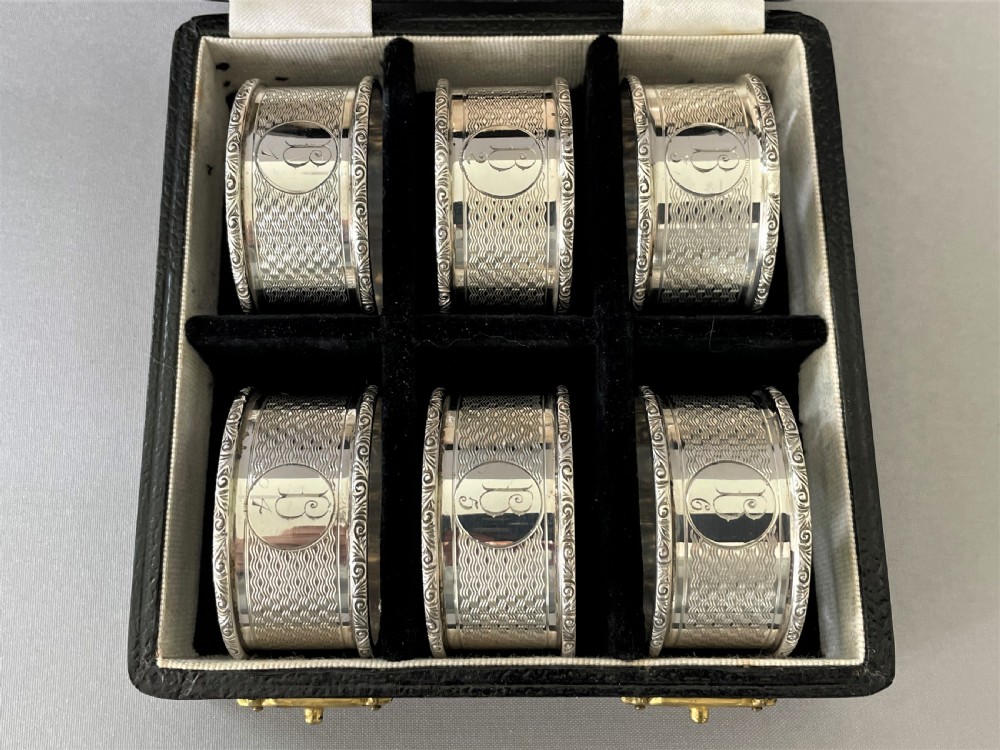 A Set Of 6 Boxed Art Deco Silver Napkin Rings View II