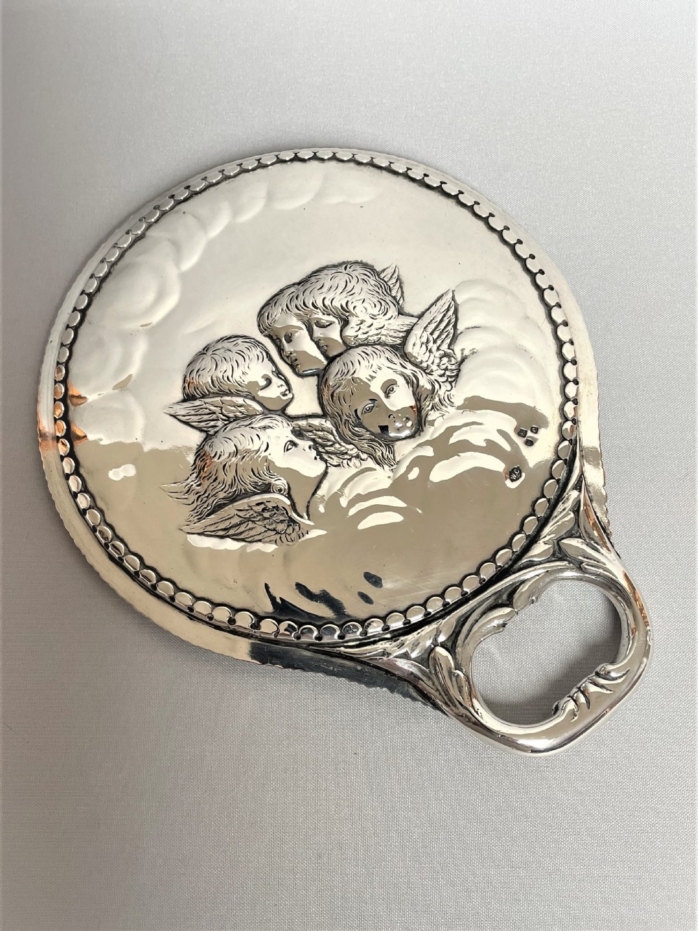A William Comyns Victorian Silver Hand Mirror, Featuring Reynold's Angels