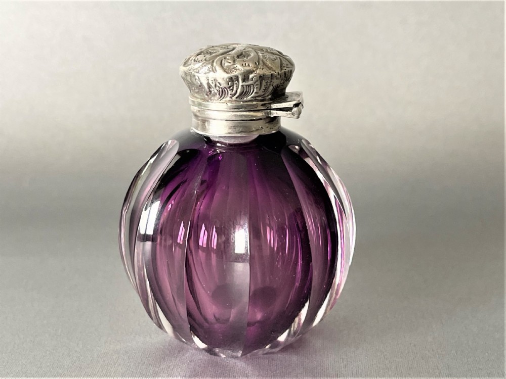 A stunning Victorian silver topped amethyst glass scent bottle