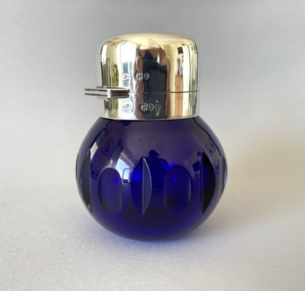 A gorgeous Victorian silver mounted cologne bottle