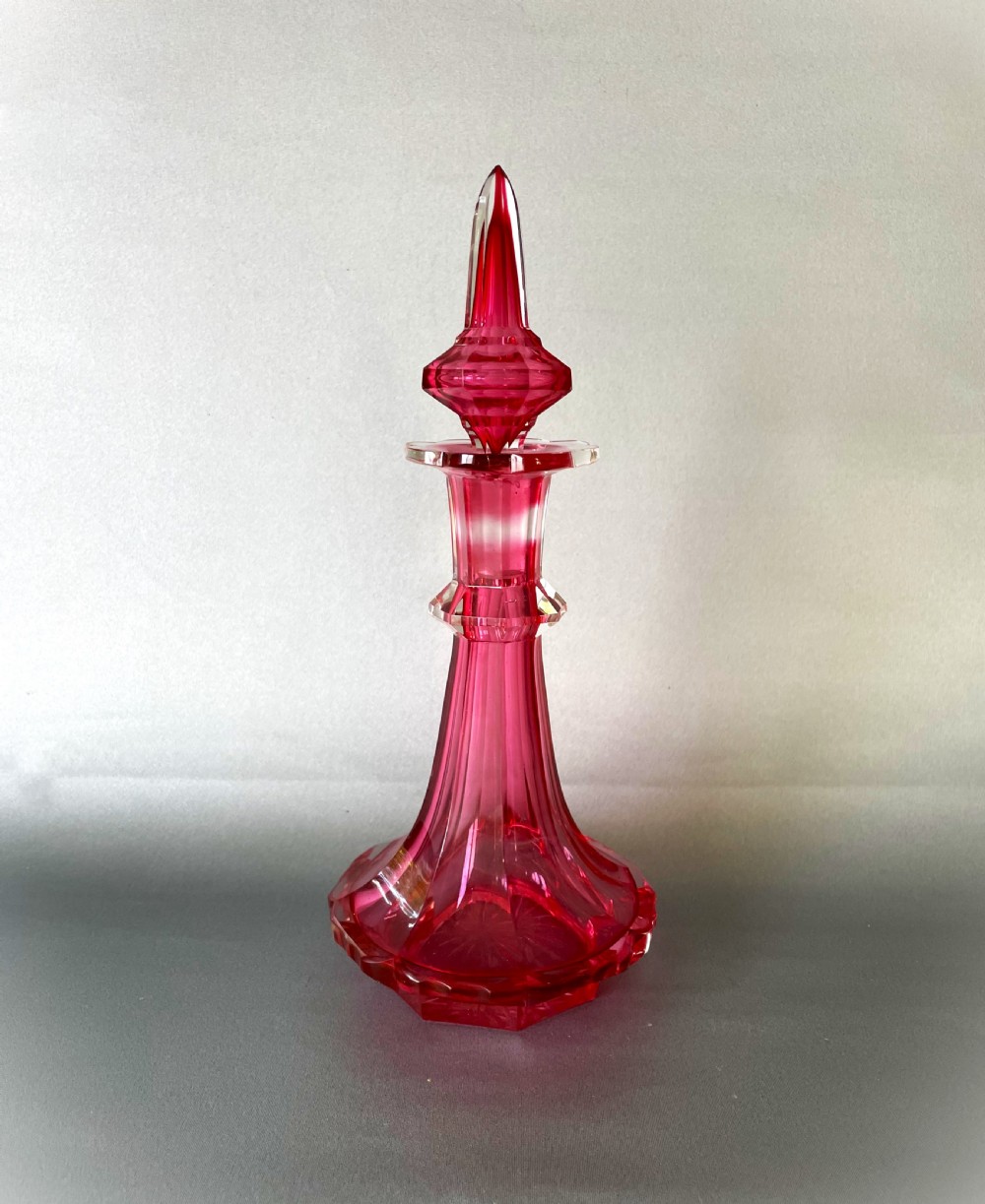 A gorgeous Victorian Gothic cranberry glass cologne bottle