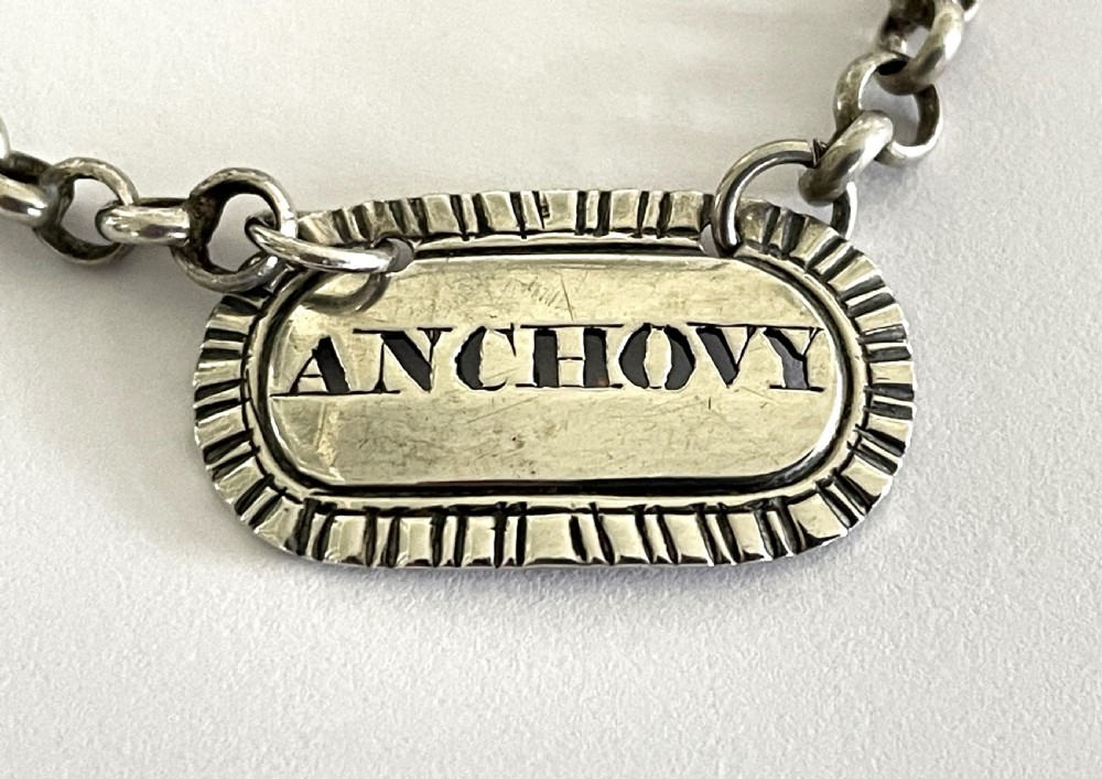 A rare George IV silver anchovy bottle ticket View III