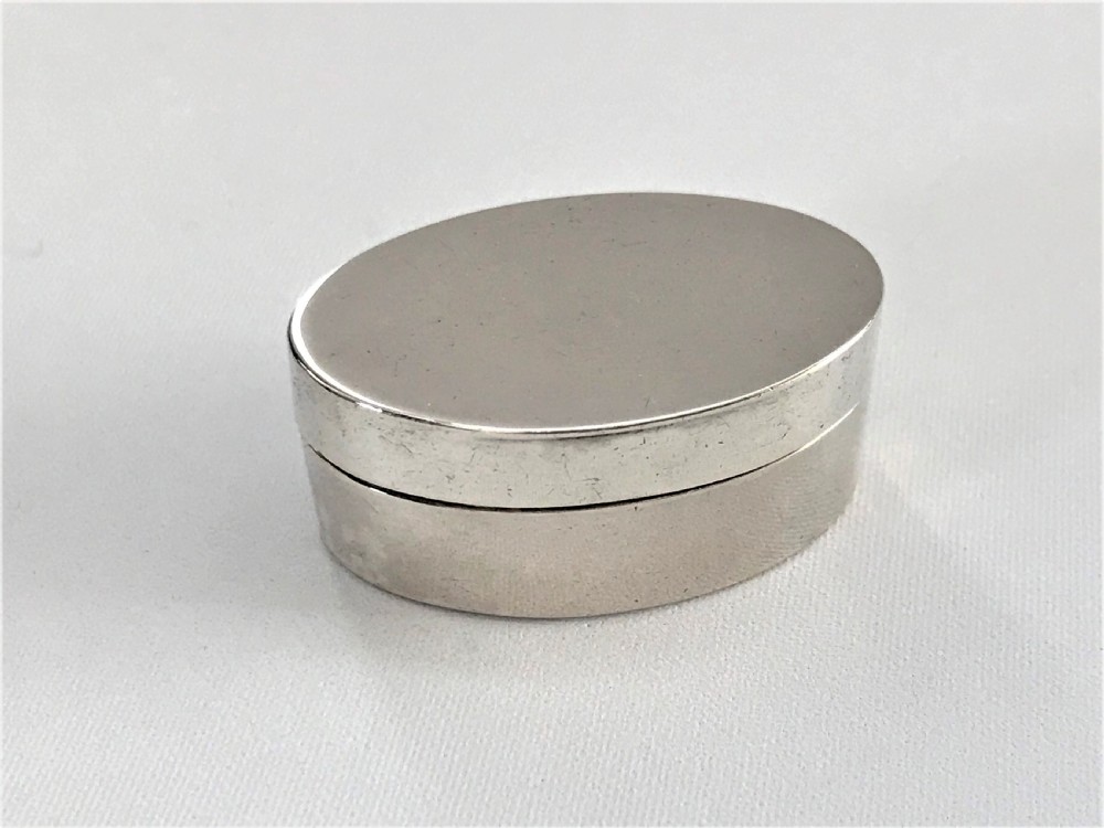 An unusual 18th Century hinged silver patch box